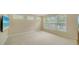 Bright and airy loft area with neutral carpet and three large windows at 3521 Fair Oaks Ln, Longboat Key, FL 34228