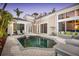 Private pool and patio, with comfortable seating, surrounded by lush tropical plants and modern architecture at 3521 Fair Oaks Ln, Longboat Key, FL 34228
