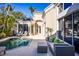 Private pool and patio area, perfect for entertaining or relaxing, with stylish outdoor furniture at 3521 Fair Oaks Ln, Longboat Key, FL 34228