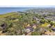 Aerial view of the property, with mature trees and waterfront access to the lake at 3619 Elm St, Ellenton, FL 34222