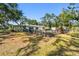 View of the backyard featuring shed and mature trees at 3619 Elm St, Ellenton, FL 34222