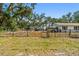 View of the backyard featuring a truck, shed, trailer and mature trees at 3619 Elm St, Ellenton, FL 34222