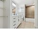 Bathroom featuring a white vanity and black hardware, modern shower and tile flooring at 3619 Elm St, Ellenton, FL 34222