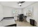 Small bedroom featuring wood-look flooring, natural light and modern ceiling fan at 3619 Elm St, Ellenton, FL 34222