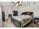 Bedroom boasts beamed ceilings, wood-look floors and bright natural light at 3619 Elm St, Ellenton, FL 34222