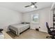 Small bedroom featuring wood-look flooring, natural light and modern ceiling fan at 3619 Elm St, Ellenton, FL 34222