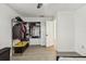 Bedroom featuring wood-look tile flooring, closet organizer and white trim and door at 3619 Elm St, Ellenton, FL 34222