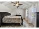 Bright bedroom featuring a ceiling fan, wood-look floors and lots of natural light at 3619 Elm St, Ellenton, FL 34222