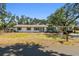 Charming single-story home featuring a neatly maintained front yard and classic architectural details at 3619 Elm St, Ellenton, FL 34222