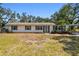 Charming single-story home with a well-manicured front lawn, architectural details, and a serene neighborhood atmosphere at 3619 Elm St, Ellenton, FL 34222