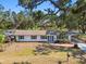 Daytime view of charming single-story home with a covered parking area at 3619 Elm St, Ellenton, FL 34222