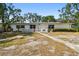 Charming single-story home with a well-maintained front yard and mature trees at 3619 Elm St, Ellenton, FL 34222