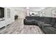 Spacious living area featuring wood-look tile flooring, an open layout, and a view of the kitchen at 3619 Elm St, Ellenton, FL 34222
