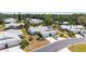 Aerial view of homes with driveways, lush landscaping, and mature trees in community at 3662 Bonaventure Ct, Sarasota, FL 34243