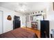 Cozy bedroom with hardwood floors, neutral walls, and eclectic decor at 3662 Bonaventure Ct, Sarasota, FL 34243