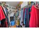 Walk-in closet with clothing racks, shelves, and storage boxes at 3662 Bonaventure Ct, Sarasota, FL 34243