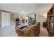Bright living room with tile flooring and a sliding door to the lanai at 3662 Bonaventure Ct, Sarasota, FL 34243
