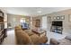 Comfortable living room featuring neutral tones, tile floors, and access to the dining area at 3662 Bonaventure Ct, Sarasota, FL 34243