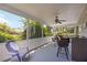 Spacious screened-in patio area with views of the backyard and landscaping at 3662 Bonaventure Ct, Sarasota, FL 34243