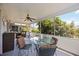 Screened-in patio with outdoor seating and a view of the lush backyard at 3662 Bonaventure Ct, Sarasota, FL 34243