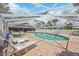 Community pool and jacuzzi area with lounge chairs and seating at 3662 Bonaventure Ct, Sarasota, FL 34243
