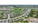 The aerial view captures the home's prime placement near a golf course and community ponds at 3679 Santa Caterina Blvd, Bradenton, FL 34211