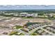 An aerial view highlights the home's position relative to a pond and nearby community park in a growing neighborhood at 3679 Santa Caterina Blvd, Bradenton, FL 34211
