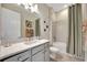 Well-lit bathroom with a shower-tub combo, modern vanity, and neutral-toned decor at 3679 Santa Caterina Blvd, Bradenton, FL 34211