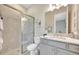 This bathroom features a tiled glass shower, neutral color palette, and sleek fixtures at 3679 Santa Caterina Blvd, Bradenton, FL 34211