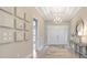Elegant foyer with high ceilings, stylish light fixture, and inviting entrance at 3679 Santa Caterina Blvd, Bradenton, FL 34211