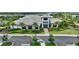 Stunning two-story home with lush landscaping, featuring a grand entrance and manicured front yard at 3679 Santa Caterina Blvd, Bradenton, FL 34211