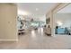 Bright and airy hallway leading to the dining and living areas with modern decor touches at 3679 Santa Caterina Blvd, Bradenton, FL 34211