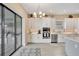Bright kitchen features white cabinets, stainless steel appliances, an island, and lots of countertop space at 3679 Santa Caterina Blvd, Bradenton, FL 34211