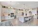 Bright kitchen features white cabinets, stainless steel appliances, an island, and lots of countertop space at 3679 Santa Caterina Blvd, Bradenton, FL 34211