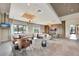 Comfortable clubhouse lounge with sofas, chairs, accent lighting, and outdoor views at 3679 Santa Caterina Blvd, Bradenton, FL 34211