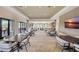 Spacious clubhouse lounge area with tables, chairs, and ample natural light at 3679 Santa Caterina Blvd, Bradenton, FL 34211