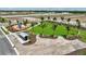 Neighborhood park featuring a playground, covered seating, manicured lawn, and landscaping, ready for Gathering enjoyment at 3679 Santa Caterina Blvd, Bradenton, FL 34211