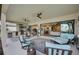 Inviting covered patio with an outdoor kitchen, comfortable seating, and seamless indoor-outdoor flow for relaxed living at 3679 Santa Caterina Blvd, Bradenton, FL 34211