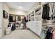 This spacious walk-in closet features custom shelving, drawers, and ample storage space at 3679 Santa Caterina Blvd, Bradenton, FL 34211