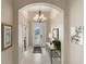 Elegant home foyer features high ceilings, neutral colors, and stylish decor, offering a grand entrance at 3740 Summerwind Cir, Bradenton, FL 34209