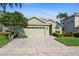 Charming single-Gathering home showcasing a lush lawn and welcoming two-car garage at 3740 Summerwind Cir, Bradenton, FL 34209