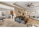Open concept living room with modern finishes, tile flooring, and seamless flow to the kitchen area at 3740 Summerwind Cir, Bradenton, FL 34209