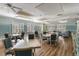 Inviting meeting room with tables, chairs, and plenty of natural light at 3740 Summerwind Cir, Bradenton, FL 34209