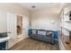 Cozy office space features a built-in bookcase, a sofa, and an adjacent room at 3740 Summerwind Cir, Bradenton, FL 34209