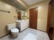 Bathroom with tile floors and a white vanity at 3957 Bearded Oaks Ct, Sarasota, FL 34232