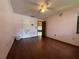 Bedroom with neutral walls, hardwood floors, and a doorway leading to the rest of the home at 3957 Bearded Oaks Ct, Sarasota, FL 34232