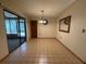 Spacious dining room with tile floors and sliding glass doors at 3957 Bearded Oaks Ct, Sarasota, FL 34232