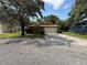 Charming single-story home featuring a two-car garage and a well-manicured lawn at 3957 Bearded Oaks Ct, Sarasota, FL 34232
