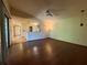 Inviting living room with hardwood floors and a seamless connection to the adjacent kitchen and dining areas at 3957 Bearded Oaks Ct, Sarasota, FL 34232