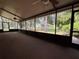 Large screened patio with ceiling fans offering a comfortable outdoor living space at 3957 Bearded Oaks Ct, Sarasota, FL 34232